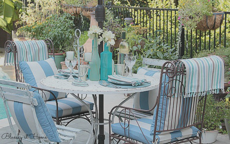 coastal tablescape with sea glass bottles