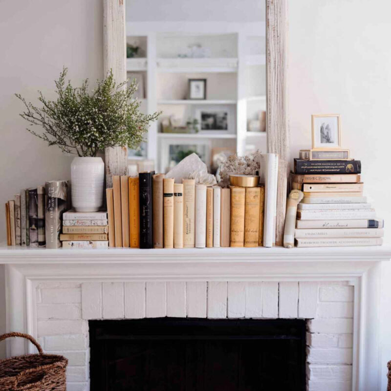 how to decorate with books on a mantel