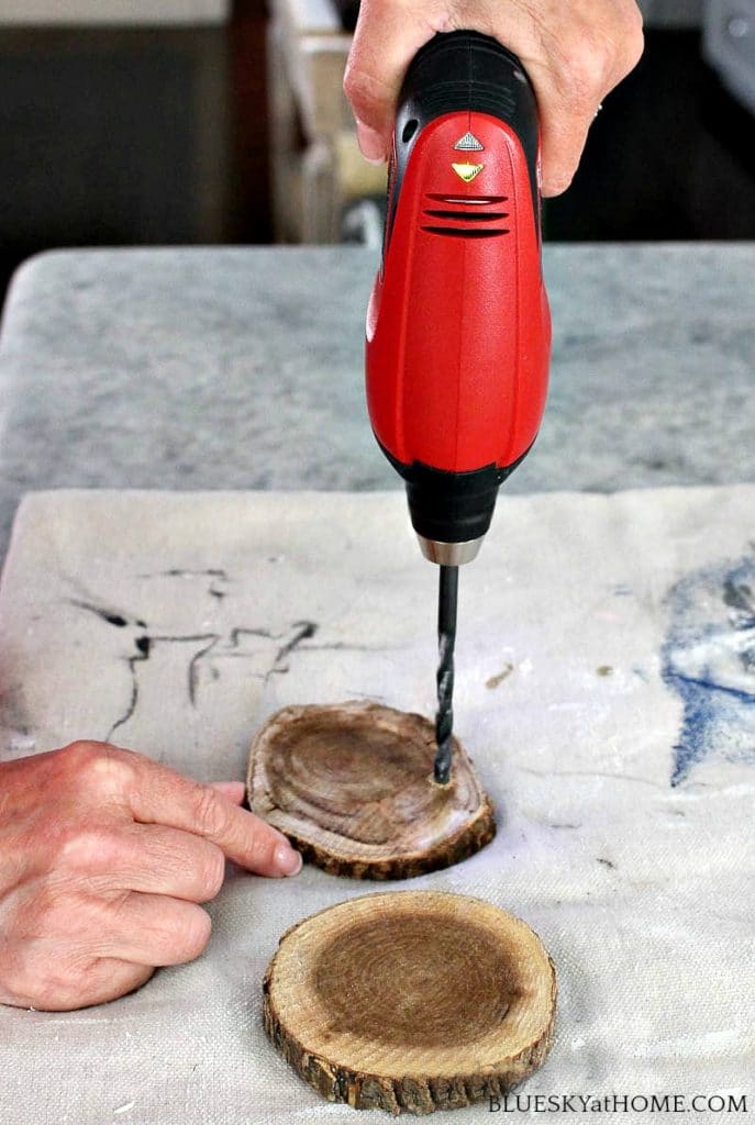 drilling hole in round wood discs for barbecue DIY project