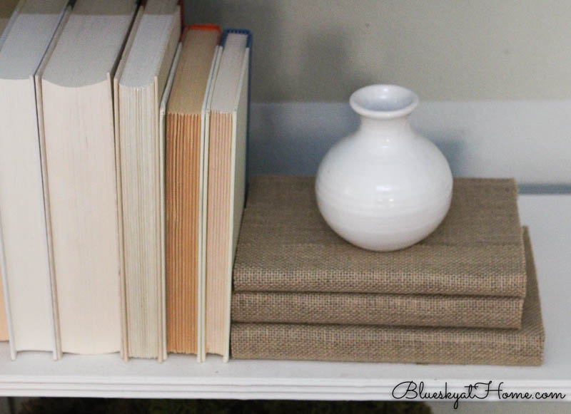 stacked burlap covered books