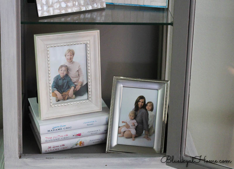 pictures on books in cabinet