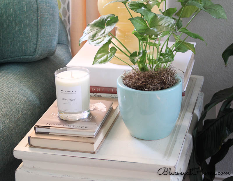 candle on stacked books