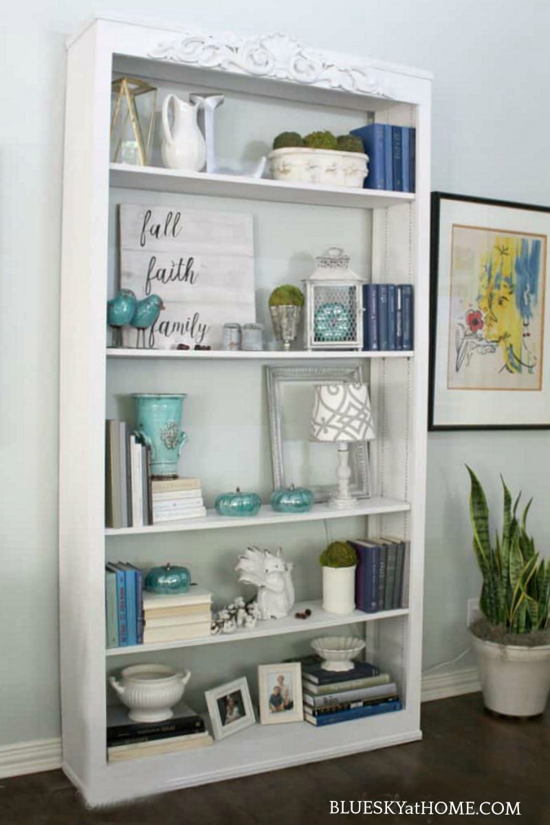 bookcase decorated with vintage fall decor