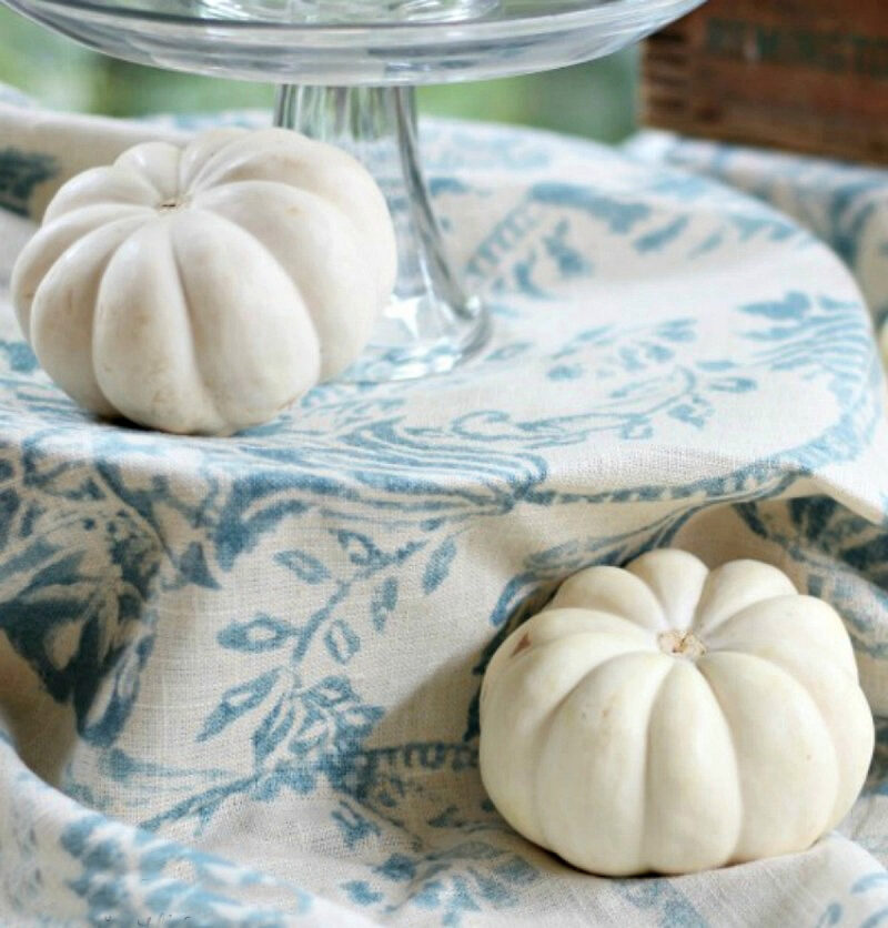 fall buffet table with white pumpkins