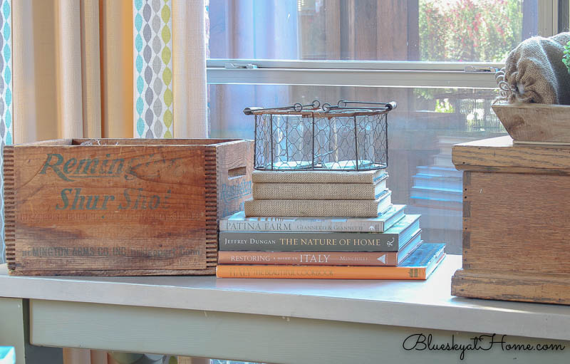 restyled table with wire and glass container on books