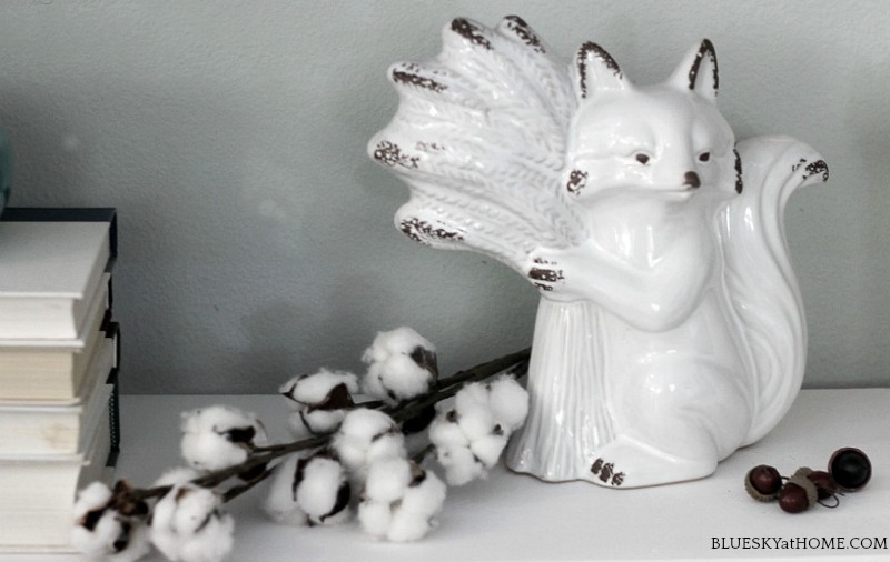 white ceramic fox in fall decor