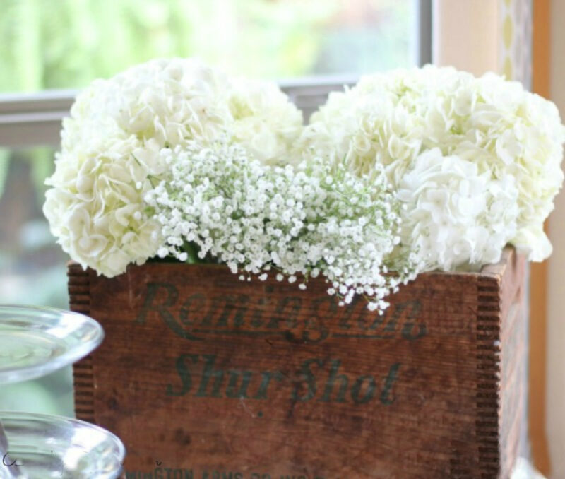 white hydrangeas in a wood box