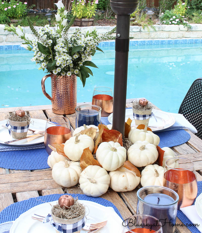 fall patio tablescape with pool in background