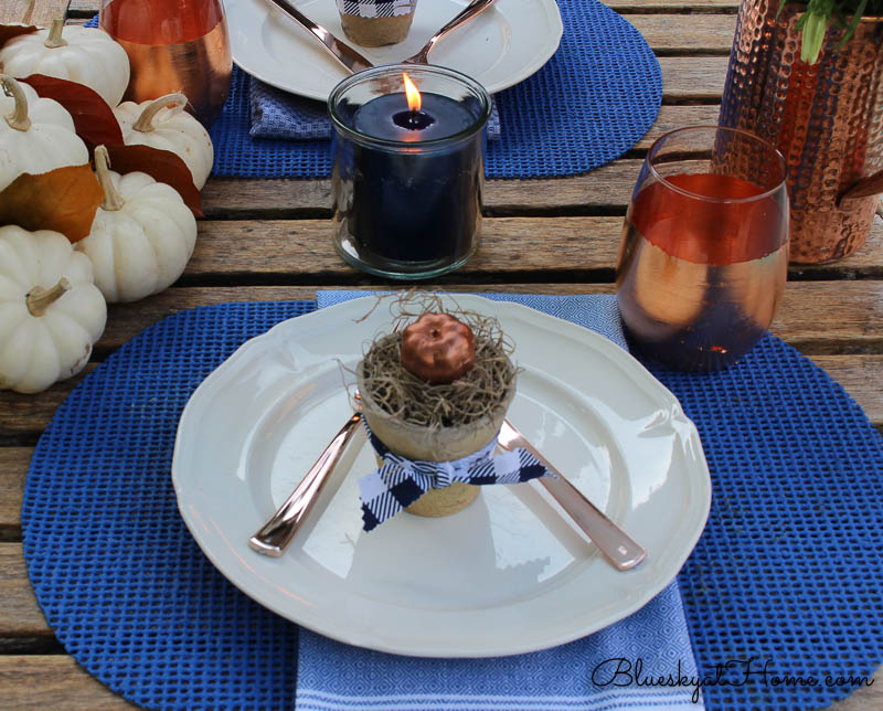 fall patio tablescape with lighted candle