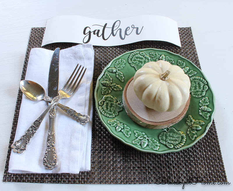 fall place setting with gather sign and pumpkin on green plate