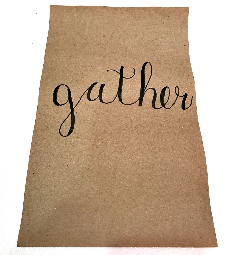 hand lettering gather on kraft paper