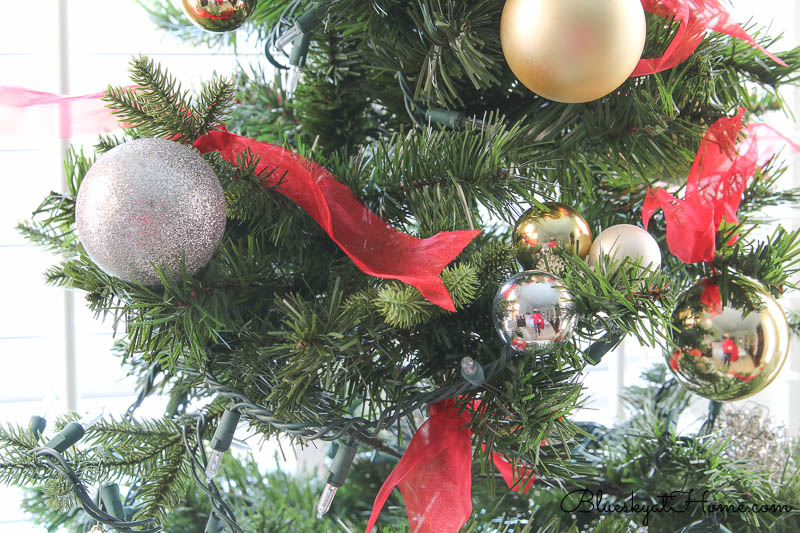 Christmas ornaments with red ribbon ties