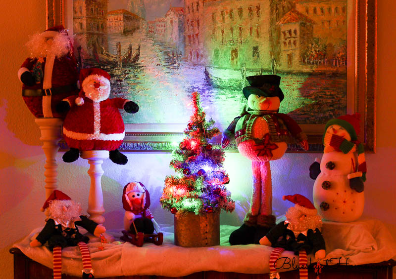 Santas and Snowmen in bedroom with Christmas Lghts