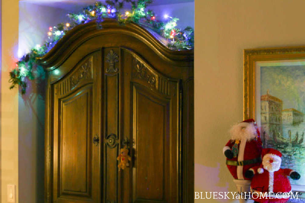 armoire with garland and lights