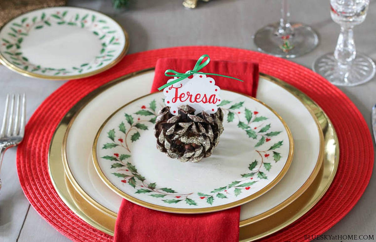 pine cone place card holder on china plate