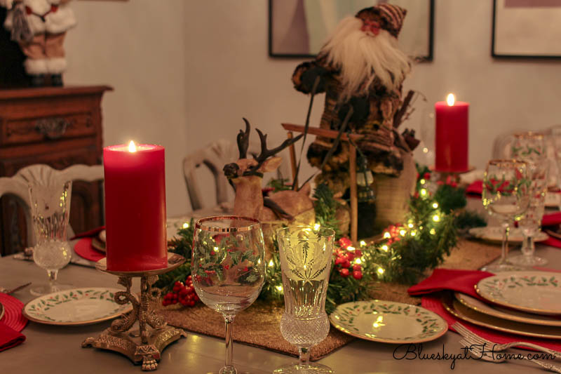 lighted Christmas tablescape with rustic Santa and sleigh