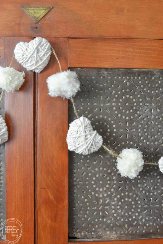 pom-pom and yarn heart garland