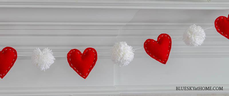 pom-pom heart garland on mantel