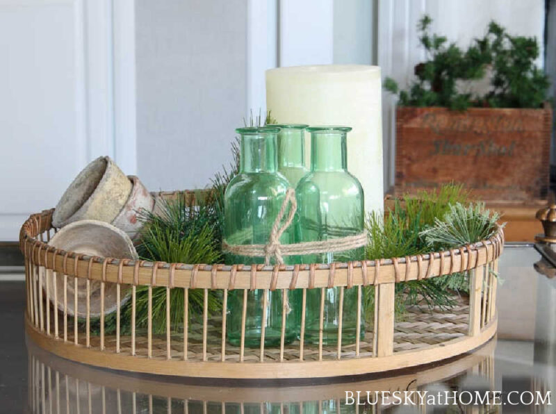 green and white winter decor basket tray on table