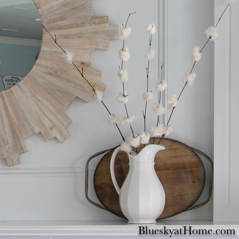 DIY cherry blossom flowers in white pitcher on mantel