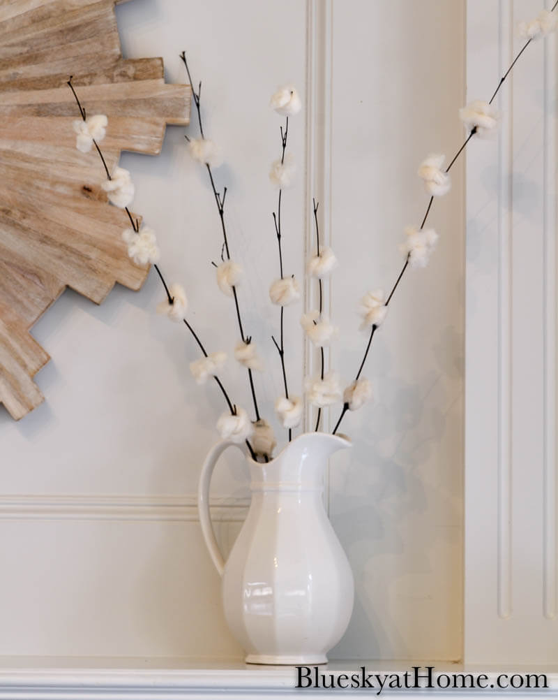 DIY cherry blossom flowers in white pitcher on mantel