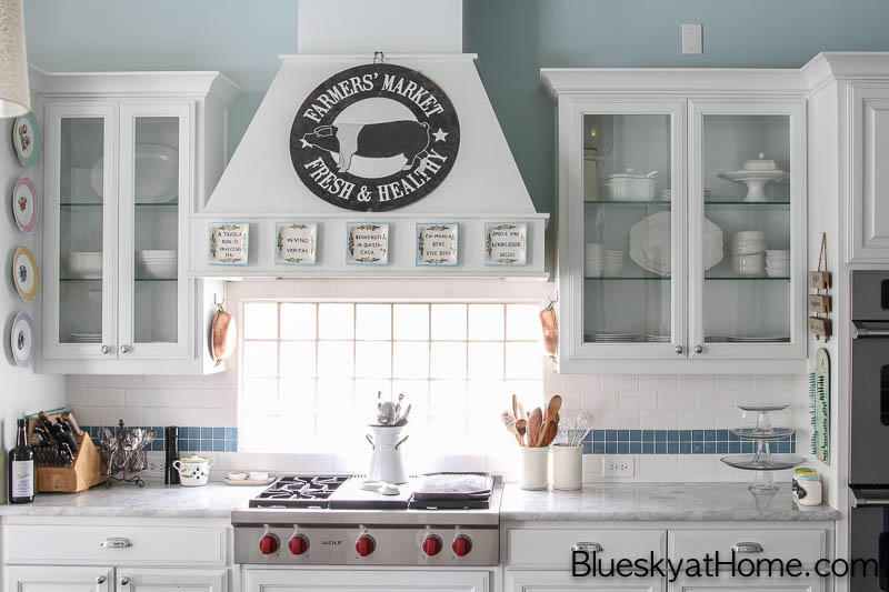 white kitchen with focal point stove and cabinets