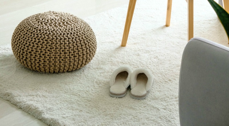 slippers on white rug