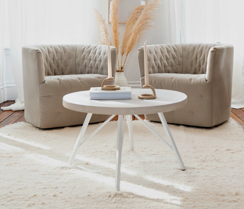 white rug and two chairs