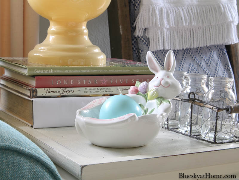 Easter bunny dish with aqua candle on table