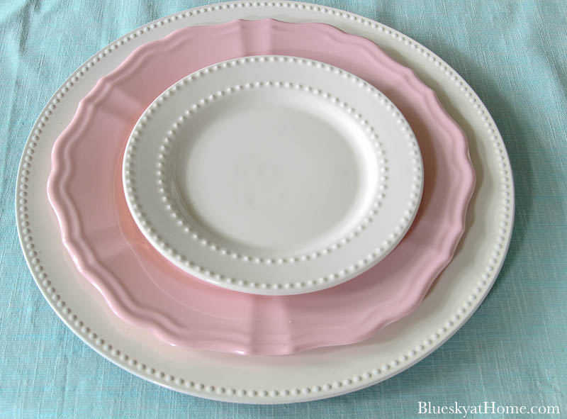 stack of pink and white plates