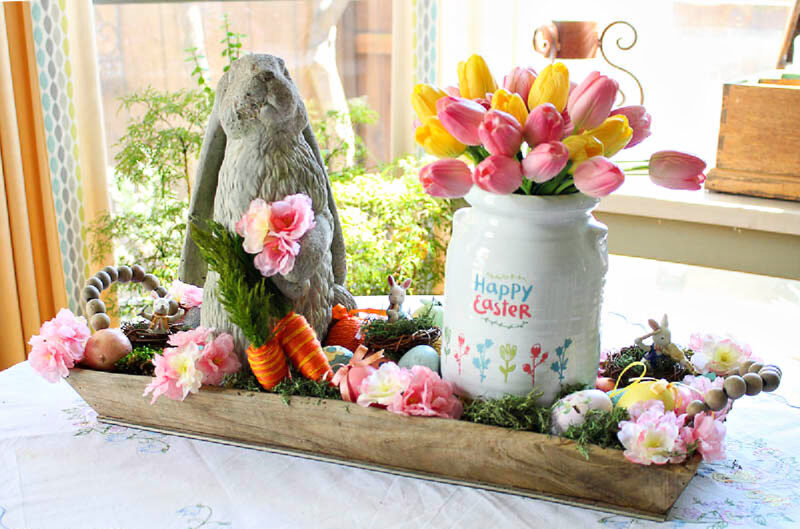 Easter centerpiece with bunnies and blooms in pink and yellow tulips