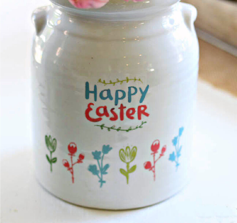 white ceramic crock with easter flowrers