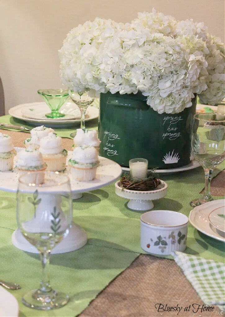 green and white planter with cupcakes