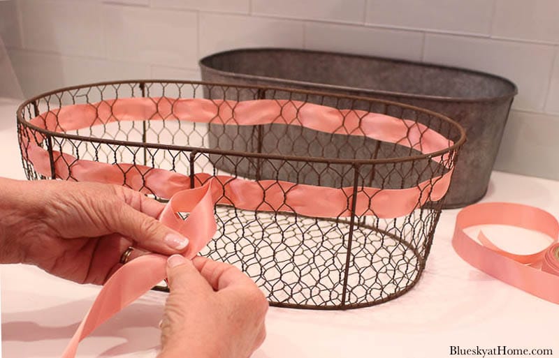 tying bow in wire basket