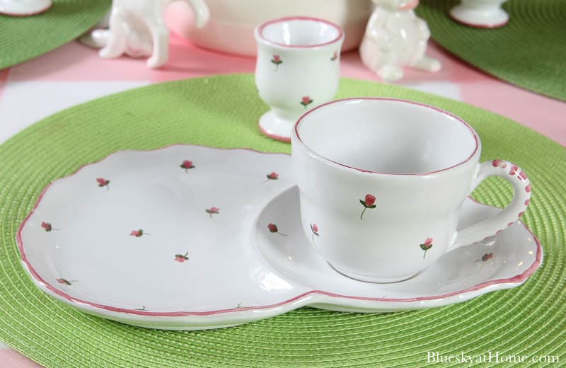 white plate and white cup with pink flowers 