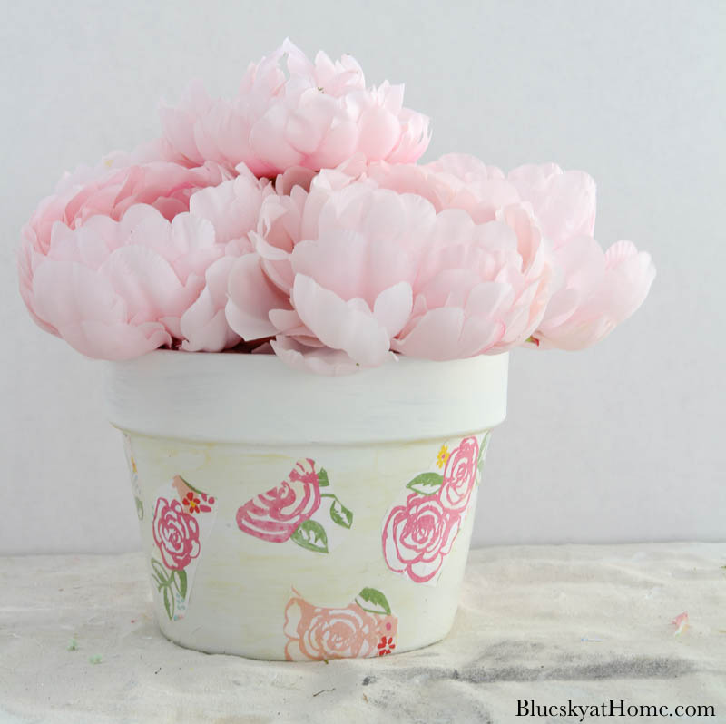 faux pink peonies in floral terra cotta pot