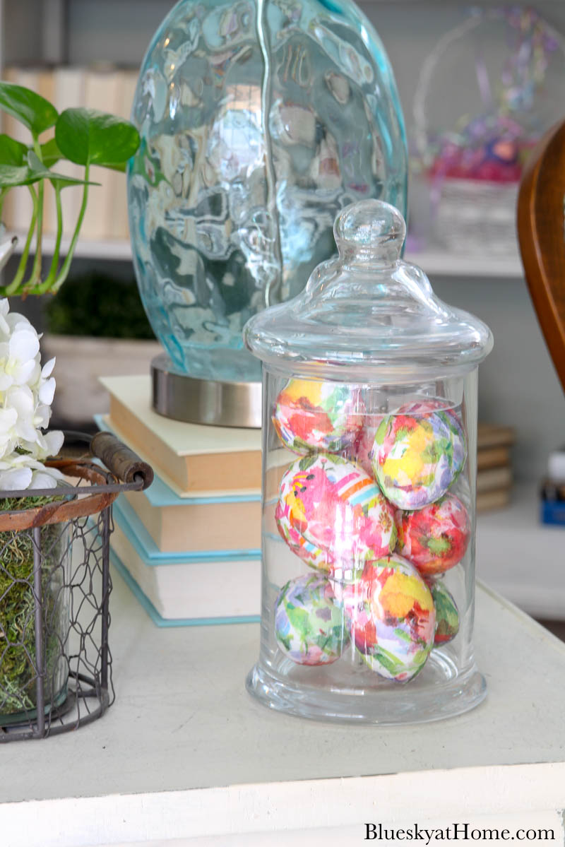 floral decorated Easter eggs in glass jar