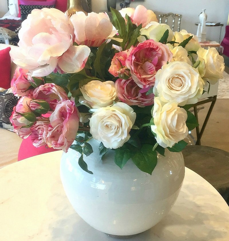 faux roses in flower arrangement