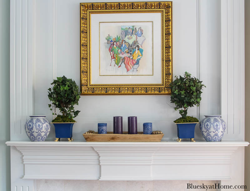 blue painted planter and blue vase on mantel