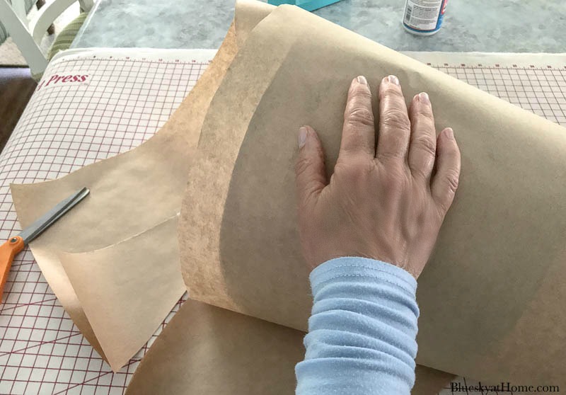 hand on brown craft paper 