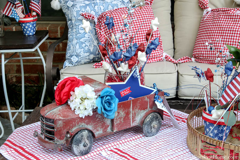 vintage red truck with 4th of July decorations