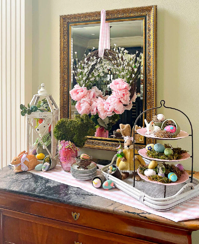 white wood lantern filled with spring decor