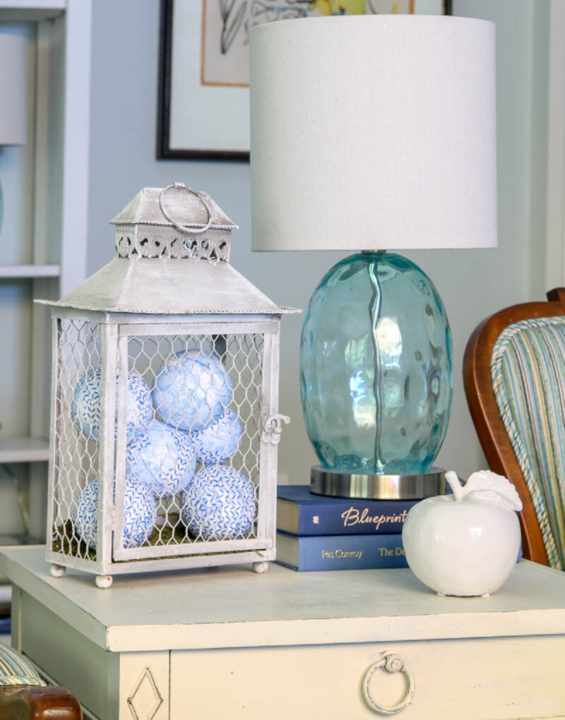 blue and white balls inside grey wred lantern