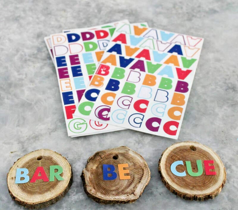 letter stickers and wood slices