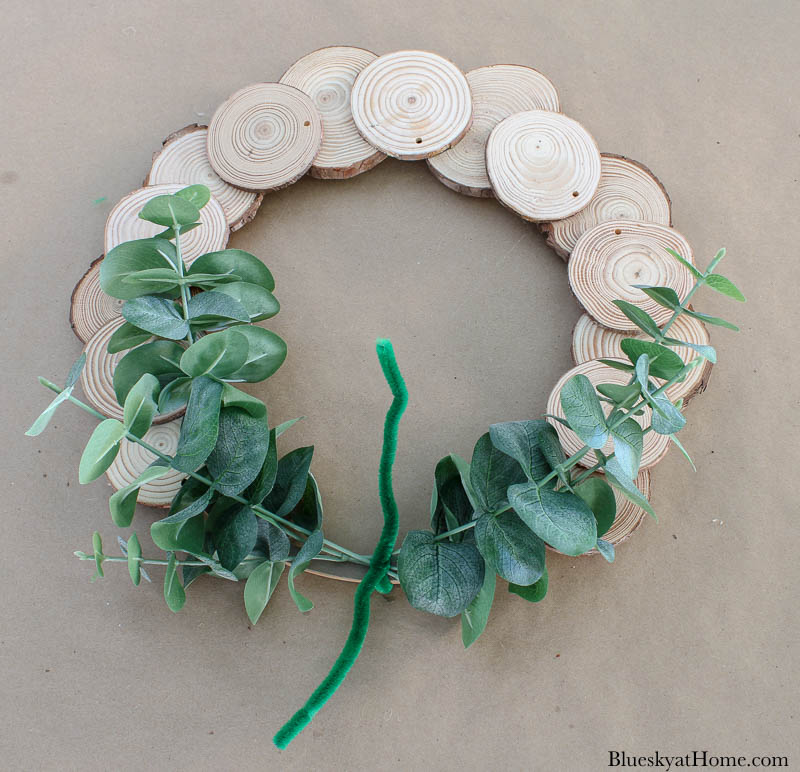 wood slice wreath with faux greenery