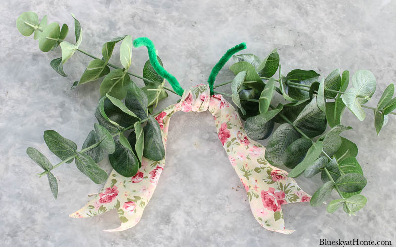 faux greenery and floral bow