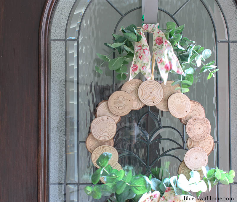 wood slice wreath on front door