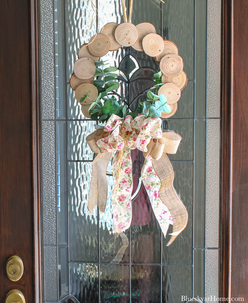 wood slice wreath on front door