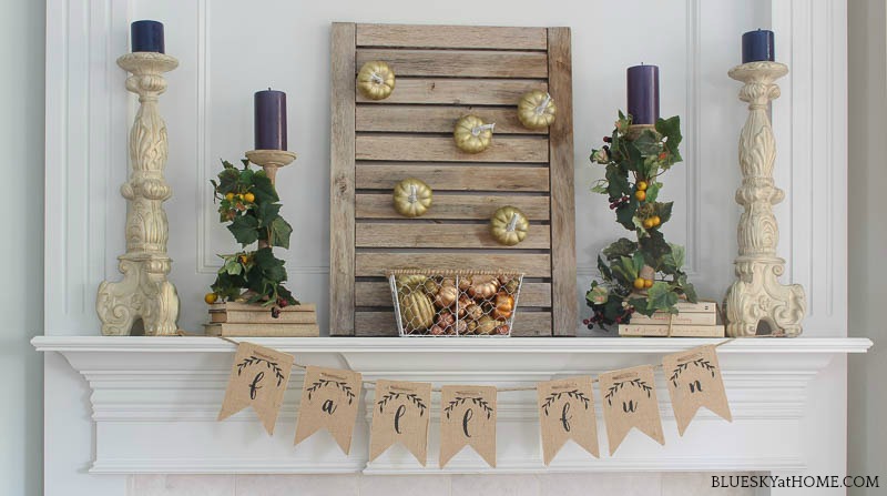 early fall mantel with teak shutter on mantel with pumpkins