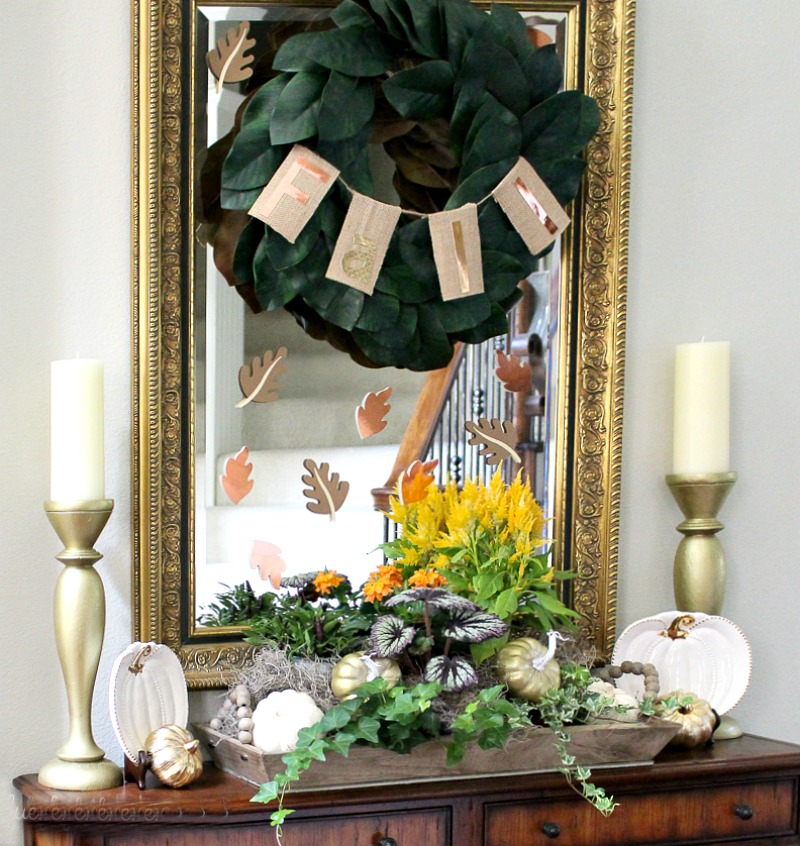 burlap banner on magnolia wreath on mirror